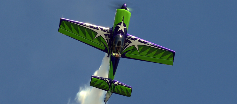 Gary Ward flying vertical straight up with smoke